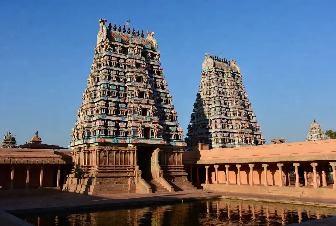 Meenakshi Amman Temple in Madurai, with its fourteen colorful gopurams rising above the city.